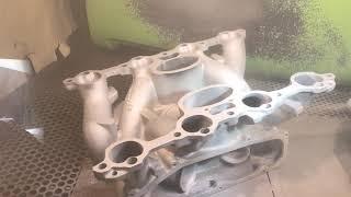 Plastic media blasting a Porsche 928 GTS intake manifold