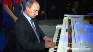 Vladimir Putin plays piano in sing-a-long at Moscow theatre