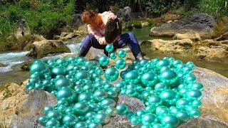 Natural pearls in fresh water can be broken apart from a clam to make a pile of pearls