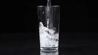 Water pouring into glasses in Slow Motion