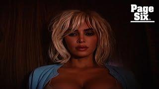 Kim Kardashian smolders in ‘unhinged’ music video for Travis Barker-produced ‘Santa Baby’ cover