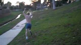 Young naked kid running in the park