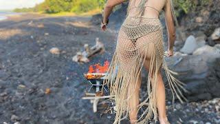 Solo camping with girl spearfishingyoung wild beauty survives on volcanic beach
