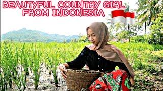 The charm of a beautiful village girl in a remote village is diligent in an Indonesian village