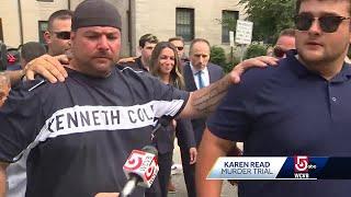 Several large men surround Karen Read as she leaves courthouse