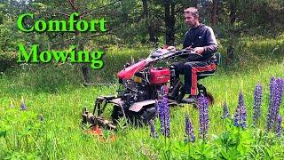 Two wheel tractor with rotary mower Mowing comfortably