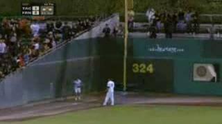 Ball girl's amazing wall-climbing catch...