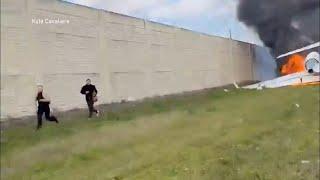 Survivors run from plane wreckage on I-75