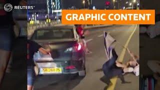 WARNING: GRAPHIC CONTENT - Car drives through Israeli protesters in Tel Aviv