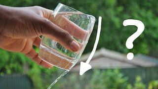 Why does water stick to your glass when pouring?