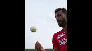 Rishi Dhawan admiring the new ball