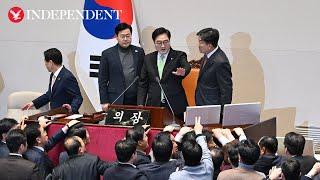 Chanting South Korean ruling party lawmakers swarm parliament in protest of impeachment vote