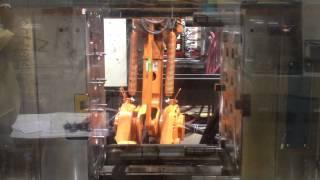 ABB robot part transfer for injection molding press overmold