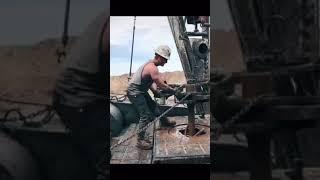 Oil rig workers throwing the chain