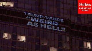 Anti-Trump And Pro-Harris Messages Are Beamed Onto Trump Tower In Chicago Before DNC Begins