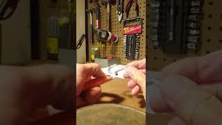 KEEPING PEGBOARD HOOKS IN PLACE