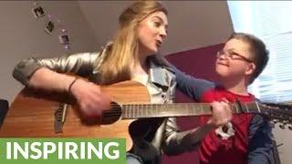 Girl plays original song for brother with down syndrome