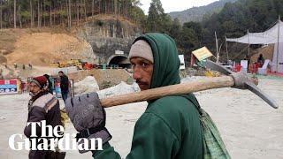 India tunnel collapse: rescuers start drilling downwards after safer options fail