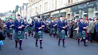 Flett from Flotta by the Vale of Atholl Pipe Band as they march in Pitlochry on New Year's day 2025