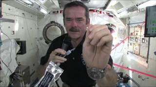 Chris Hadfield demonstrates how astronauts wash their hands in zero-g