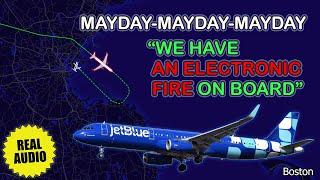 Fire on board due to cell phone battery. JetBlue Airbus A321 declares MAYDAY at Boston. Real ATC