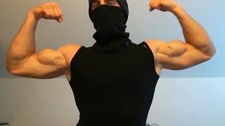 Young masked bodybuilder flexing his big biceps