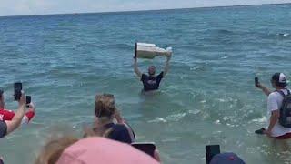 Florida Panthers star, St. Louis native Matthew Tkachuk takes a dip in the ocean with Stanley Cup