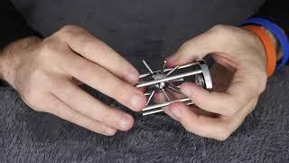 Solving The Caged SPIKED BALL Puzzle