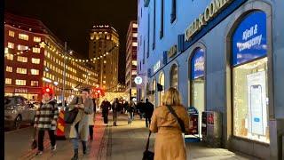 Stockholm is starting Christmas. Walking among lights, people and tiny snowflakes of Kungsgatan