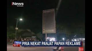 iNews NTT - Pria di Kupang Bentangkan Spanduk Kritikan dan HUT Polri Diatas Papan Reklame