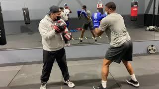 Wizard of boxing mittwork with beginner fighter. Basic combos and boxing movements.