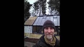 Greenhouse with attached cedar and tiled roof shed.113