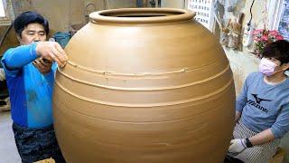 Process of making biggest Korean traditional jar. Korean handmade pot master