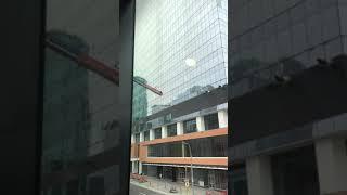 Edmonton window washer on swing scaffolding on the outside of Stantec building (Safety at work)