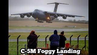 C-5M SuperGalaxy landing in heavy fog