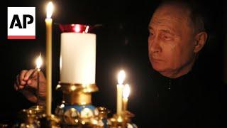 Putin visits church and places candles for victims of Moscow attack
