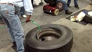 Using Ken-Tool's Serpent bar to demount an 11R22.5 truck tire at MATS 2010 in Louisville.