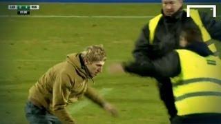 FUNNY! Pitch invader dribbles past two stewards