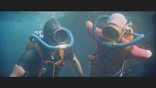 Female diver in vintage scuba gear [September Storm]