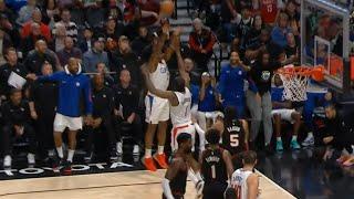 James Harden tries to block Kawhi Leonard's shot attempt 