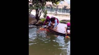 Feeding fish with milk bottle