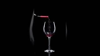 WINE POURING IN GLASS . SATISFYING SOUND