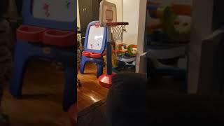 1 year old shooting baskets