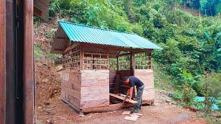 Build and complete a wooden house in the forest before heavy rain and storm.