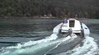 Skoota 20 powercat to 10 knots from standing start.wmv