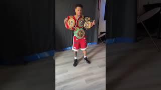 undisputed lightweight champion devin haney poses with the belts looking ripped