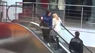 Another blonde trying to beat the escalator