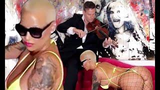 Amber Rose displays peachy derriere in fishnet stockings as she twerks on all fours for violinist