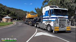 Kenworth T610 SAR, Kenworth K200, & Kenworth T608 heading down the freeway