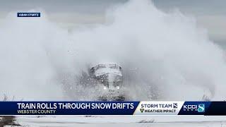 WATCH: Train plows through huge snowdrifts after Iowa blizzard